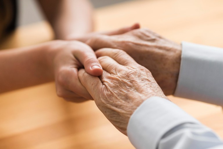 nurse-holding-senior-man-s-hands-empathy.jpg