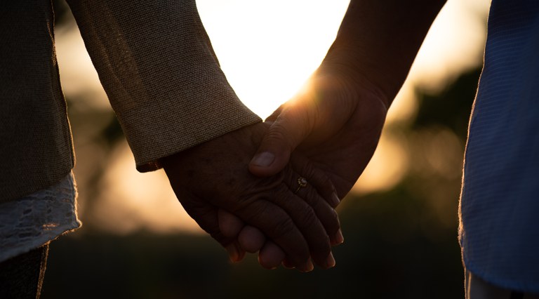 friendship-love-valentine-day-concept-happy-senior-couple-holding-hand-sunset.jpg