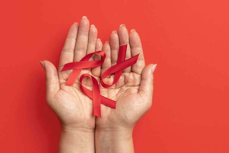 person-holding-world-aids-day-ribbon-symbol.jpg