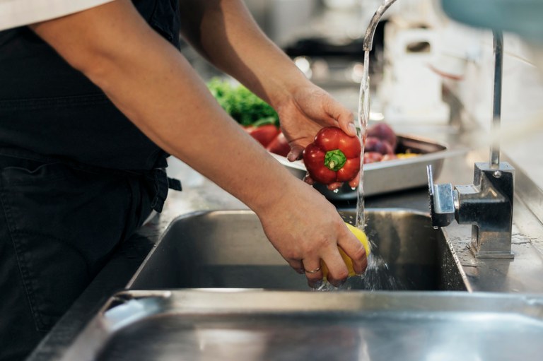 side-view-of-male-chef-washing-vegetables (1).jpg