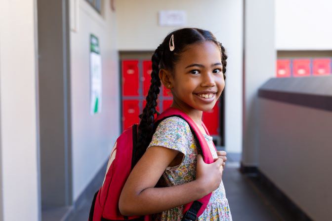 portrait-of-happy-biracial-schoolgirl-with-school-2023-08-02-05-49-39-utc_.jpg