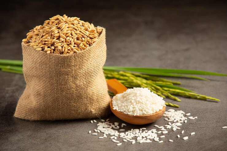 sack-rice-seed-with-white-rice-small-wooden-spoon-rice-plant_1150-35744.jpg