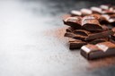 pieces-of-chocolate-on-a-wooden-table-and-cacao-sprinkled.jpg