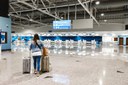 woman-walks-along-the-airport-with-suitcases.jpg