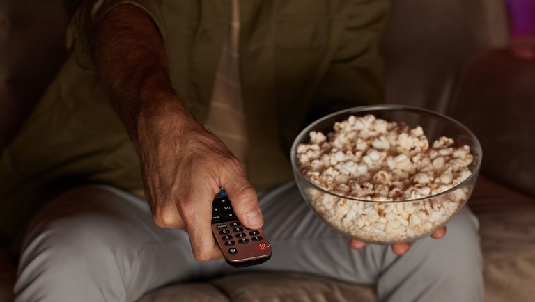 man-with-popcorn-watching-tv-2021-08-29-06-51-48-utc.jpg