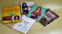 Rita Lobo doa livros ao Consea e diz que cozinhar comida de verdade mudou sua vida